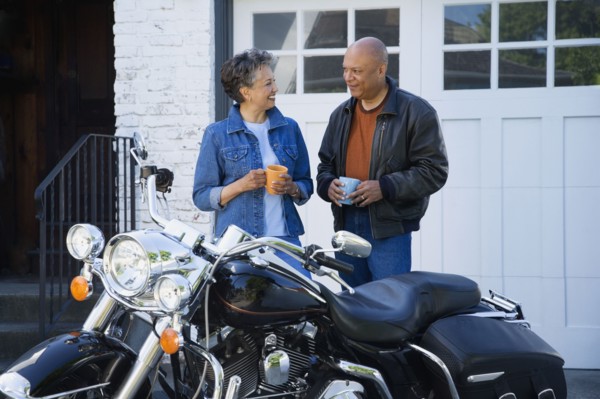 Senior African American couple next to motorcycle
