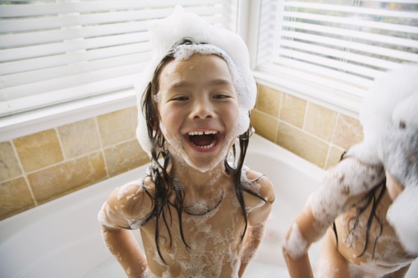 Asian sisters in bubble bath