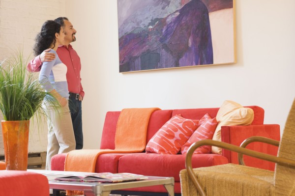 Hispanic couple looking at artwork