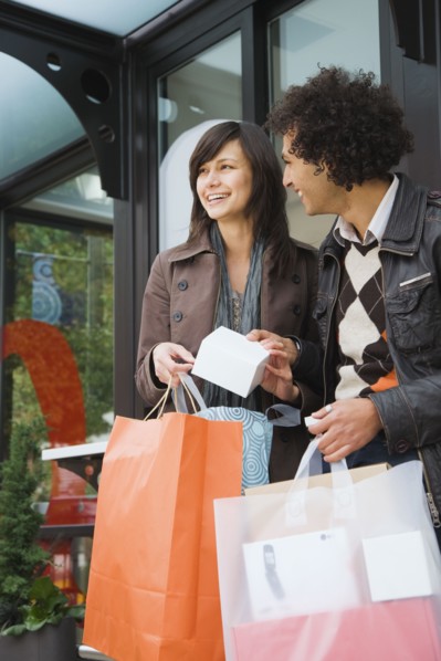 Couple with merchandise and shopping bags