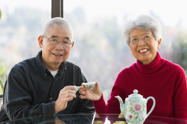 Chinese couple having tea together