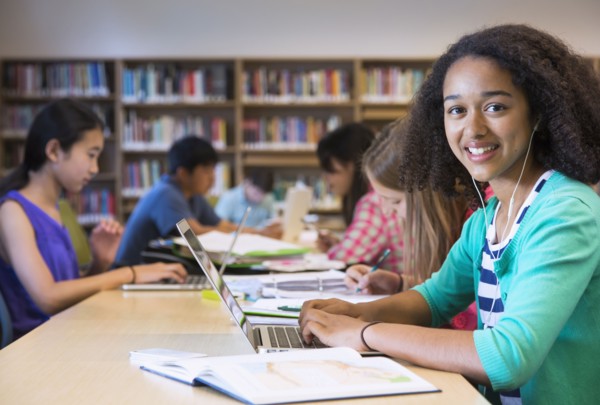 Student using laptop in library
