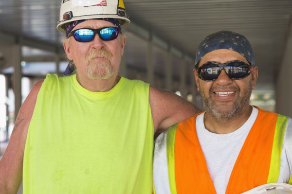 Workers smiling at construction site