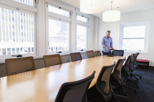Businessman standing at table in conference room