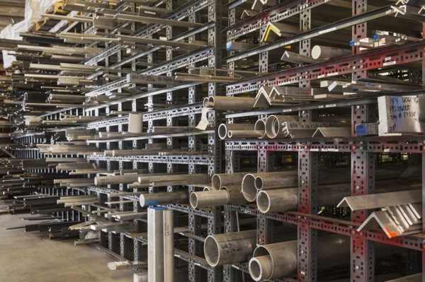 Metal parts on racks in warehouse