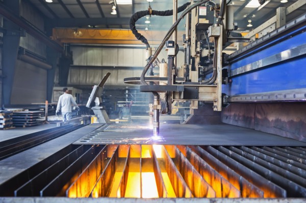 Machinery fabricating metal in factory