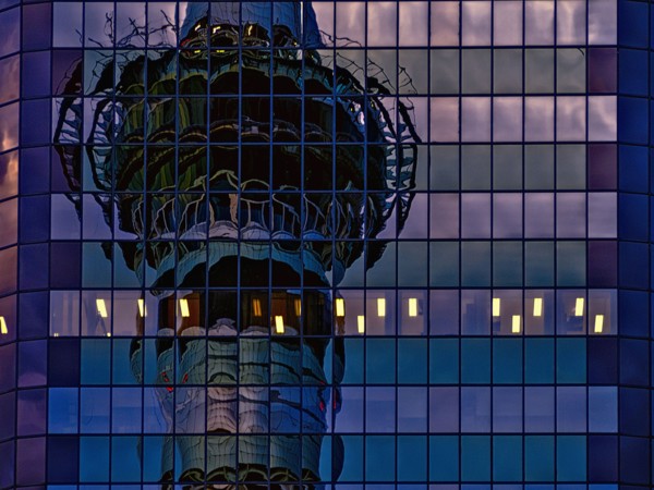Skytower reflected in skyscraper windows