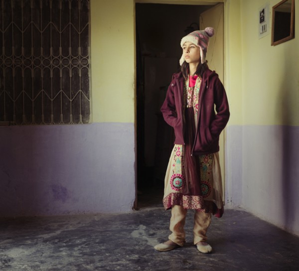 Mixed race girl wearing traditional clothing