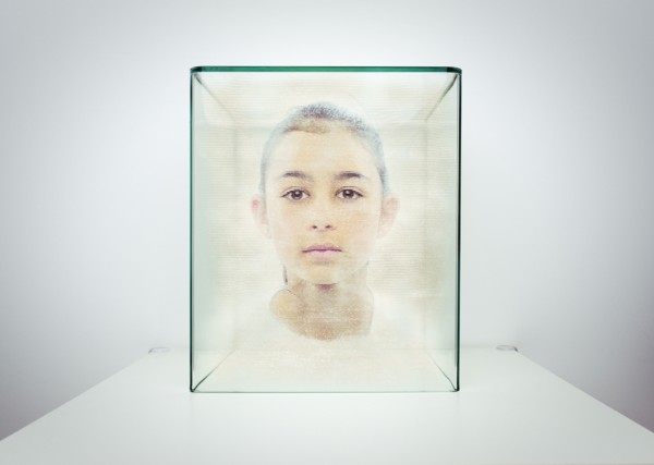 Hologram of Mixed race girl in glass box
