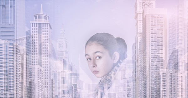 Mixed race girl over city skyline