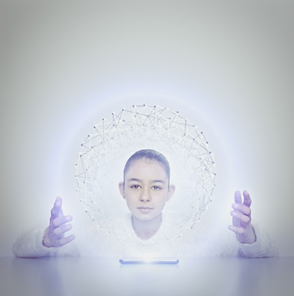 Mixed race girl holding sphere from digital tablet