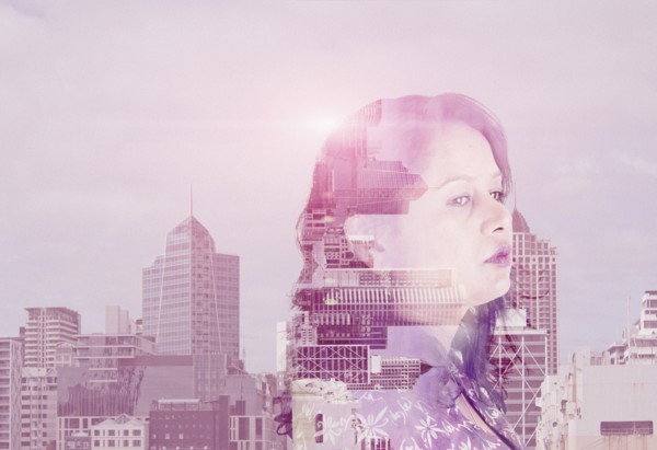 Double exposure of mixed race woman and cityscape
