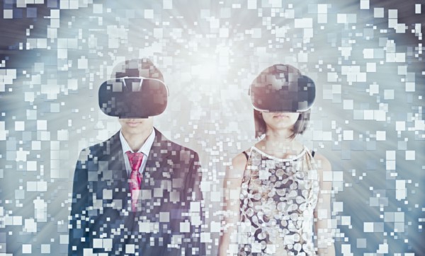 Mixed Race brother and sister using vr goggles