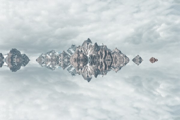 Mirror image of mountains and clouds