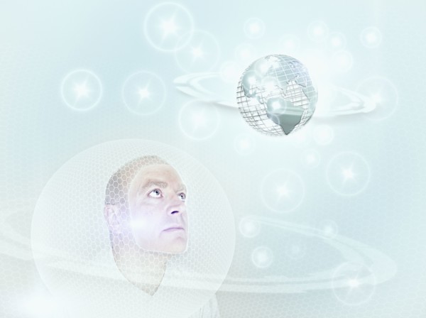 Caucasian man looking at globe in cyberspace