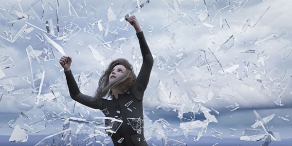 Shards of glass falling on woman
