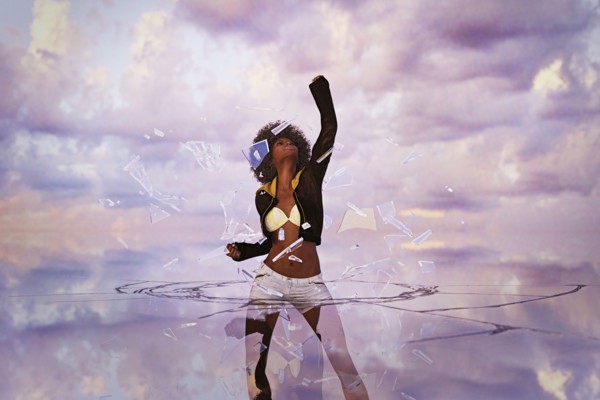 Woman punching through glass ceiling