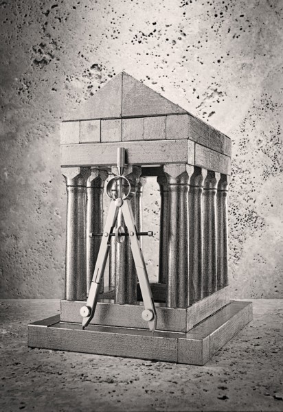Silver model of pillars and archway with compass