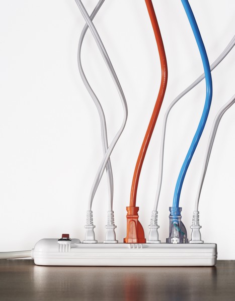 Close up of cords plugged into power strip