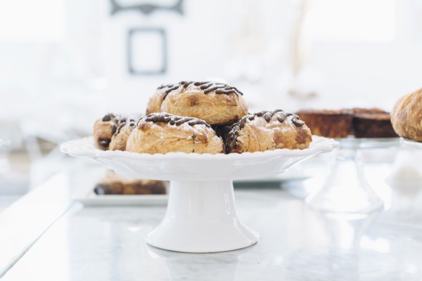 Close up of platter of donuts on cafe counter