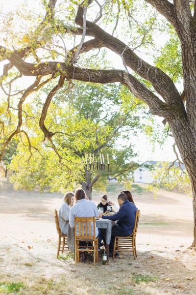Friends eating at outdoor table