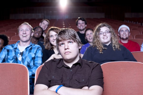 Friends watching movie in theater