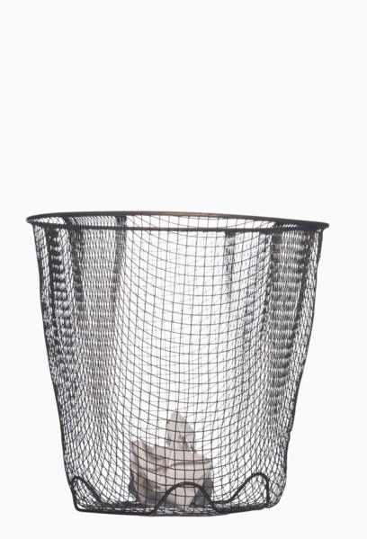 Crumpled paper in wastepaper basket