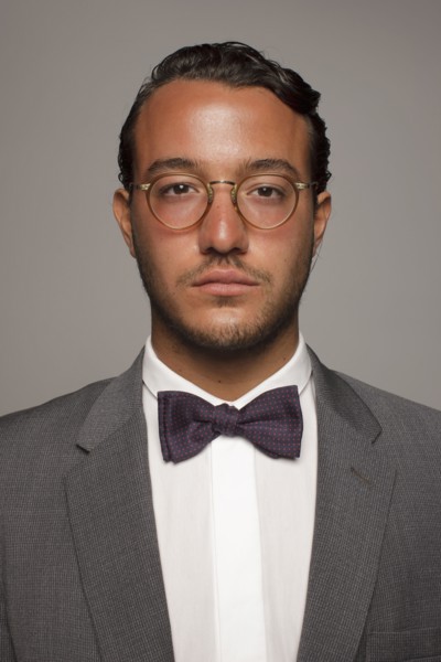 Serious Caucasian man in suit and bow tie