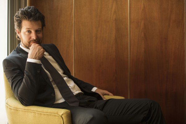 Caucasian businessman sitting in armchair