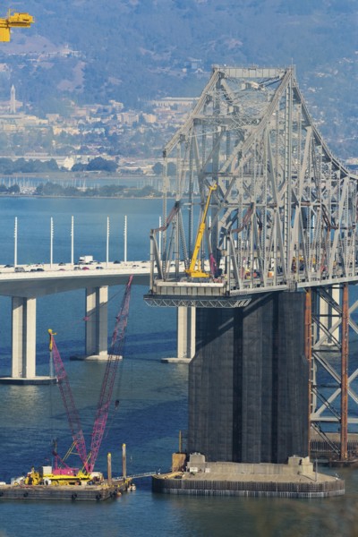 Bridge under construction over bay