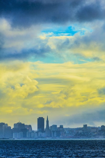 Silhouette of San Francisco city skyline under sunset sky
