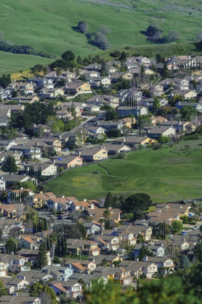 Aerial view of suburban neighborhood in rolling landscape