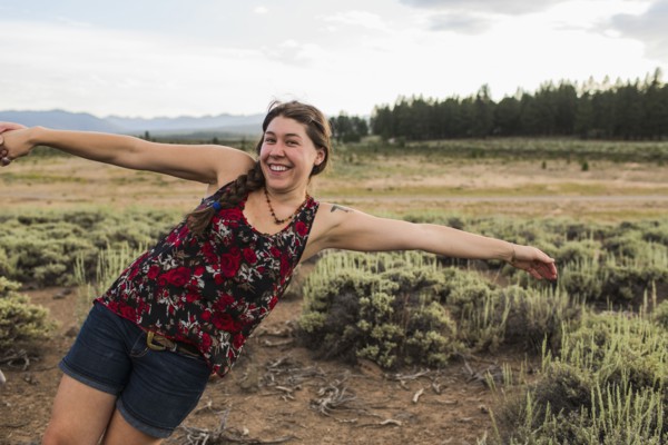 Caucasian woman posing in remote field
