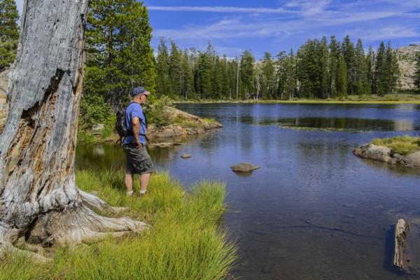 Caucasian man admiring remote lake