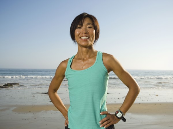 Asian woman with hands on hips