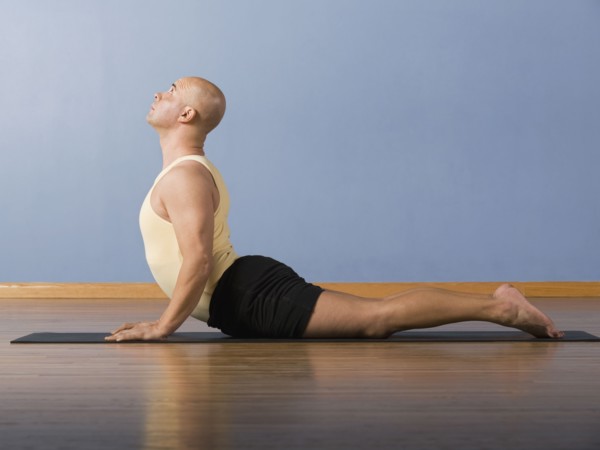 Hispanic man practicing yoga