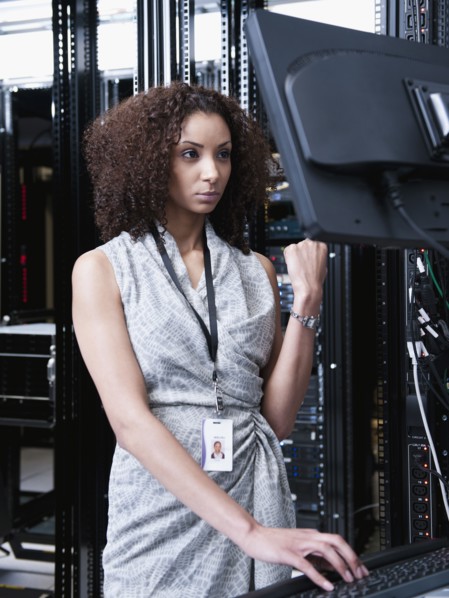 Black businesswoman working in server room