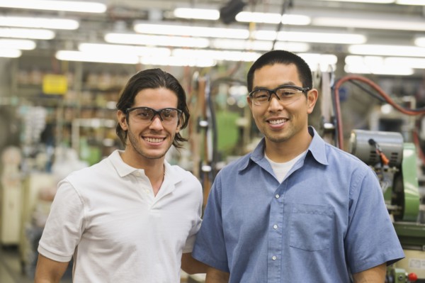 Workers smiling in textile factory