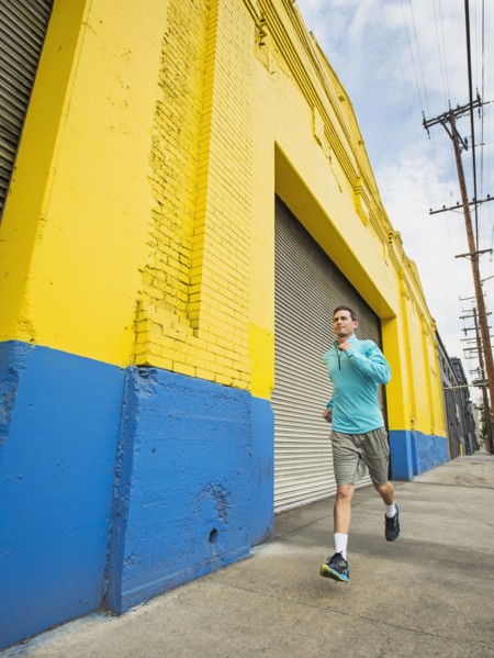 Caucasian man running on city street