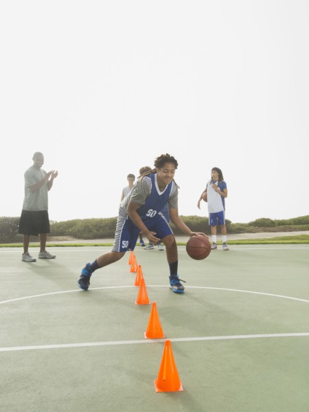 Basketball team doing drills at practice