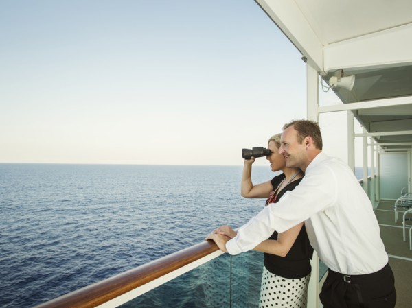 Caucasian couple admiring view from boat deck