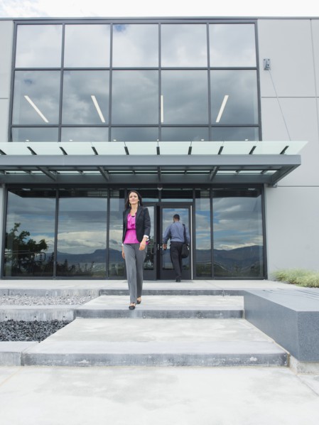Businesswoman walking outside office building