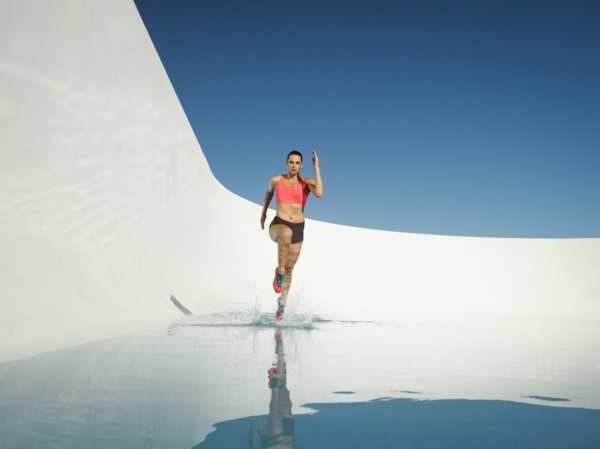 Caucasian woman running on water surface