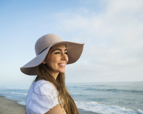 Caucasian woman smiling on beach
