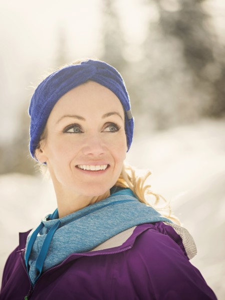 Caucasian woman smiling in snow