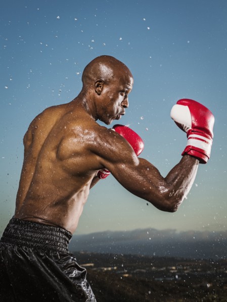 Water splashing on black boxer outdoors