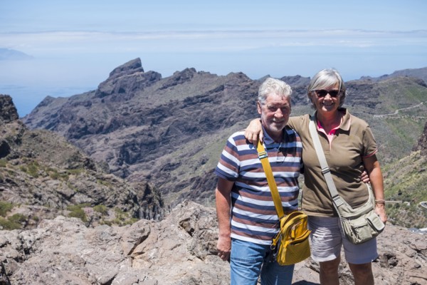 Portrait of smiling older Caucasian couple on mountain