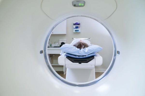 Caucasian patient laying on scanner table