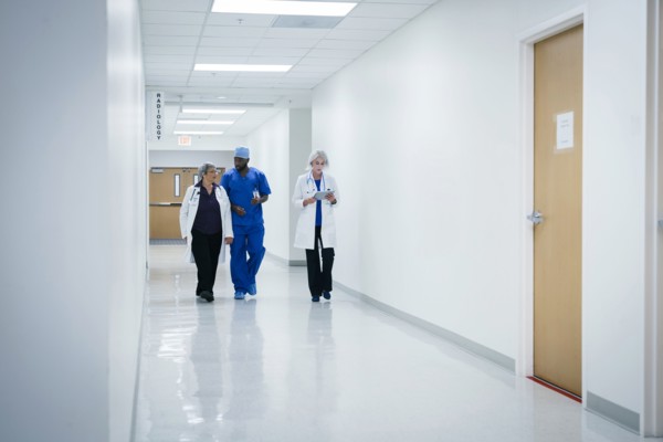 Doctors and nurse walking in hospital