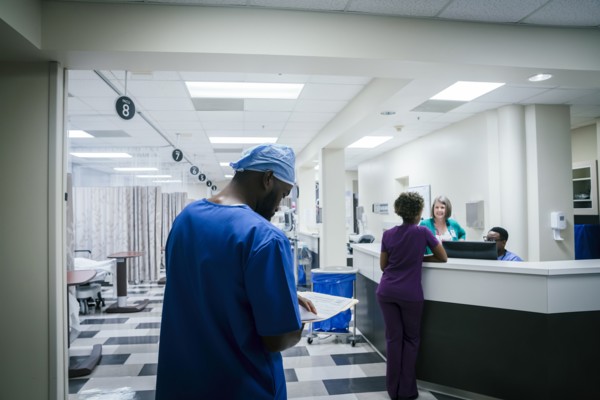 Nurse reading paperwork in hospital